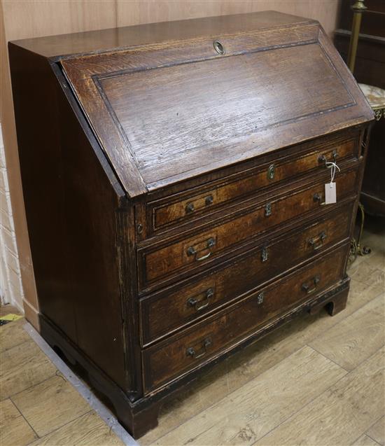 A George III oak bureau W.103cm